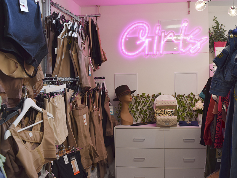 shapewears and a pink "girls" sign on the wall of anna castro boutique